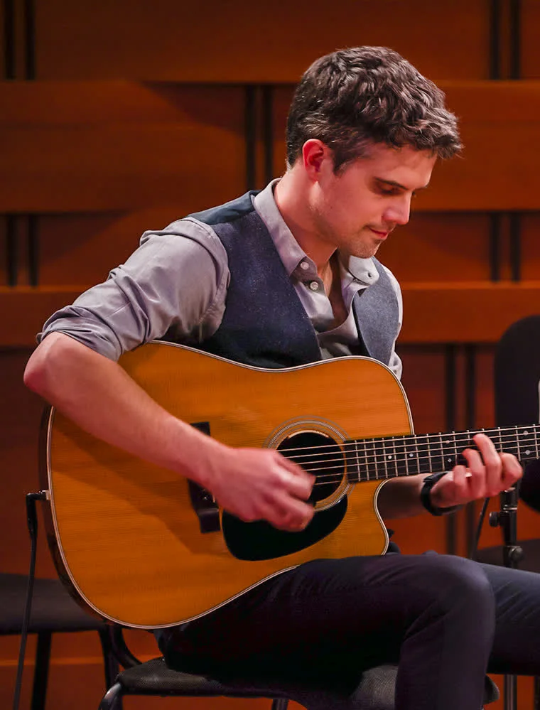 Nathan Gourley playing guitar